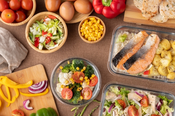 Arrangement of colorful seasonal ingredients representing balanced and varied everyday meals